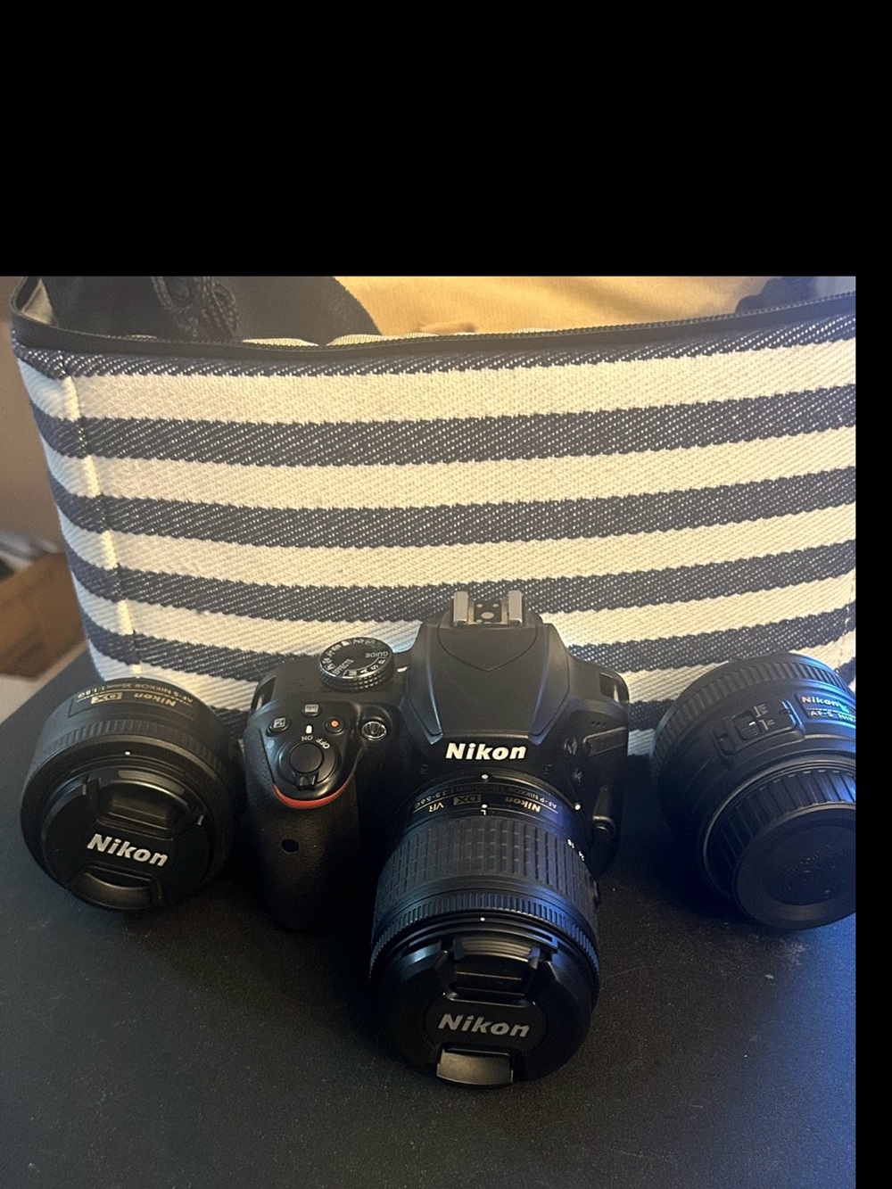 Nikon Black DSLR Camera Body with Three Black Lenses